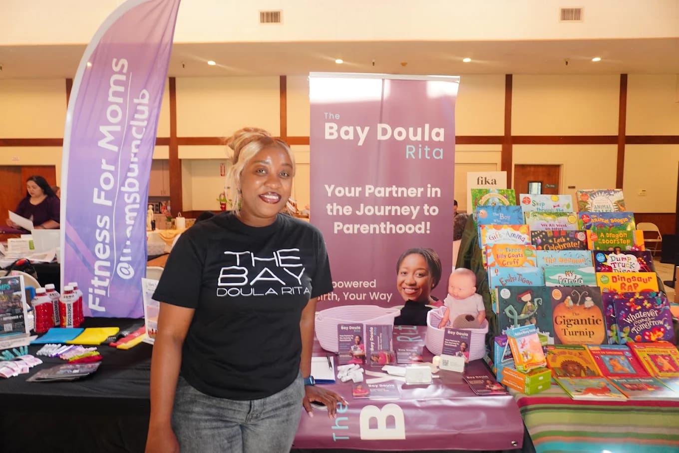 Rithalorine smiling at a community event booth